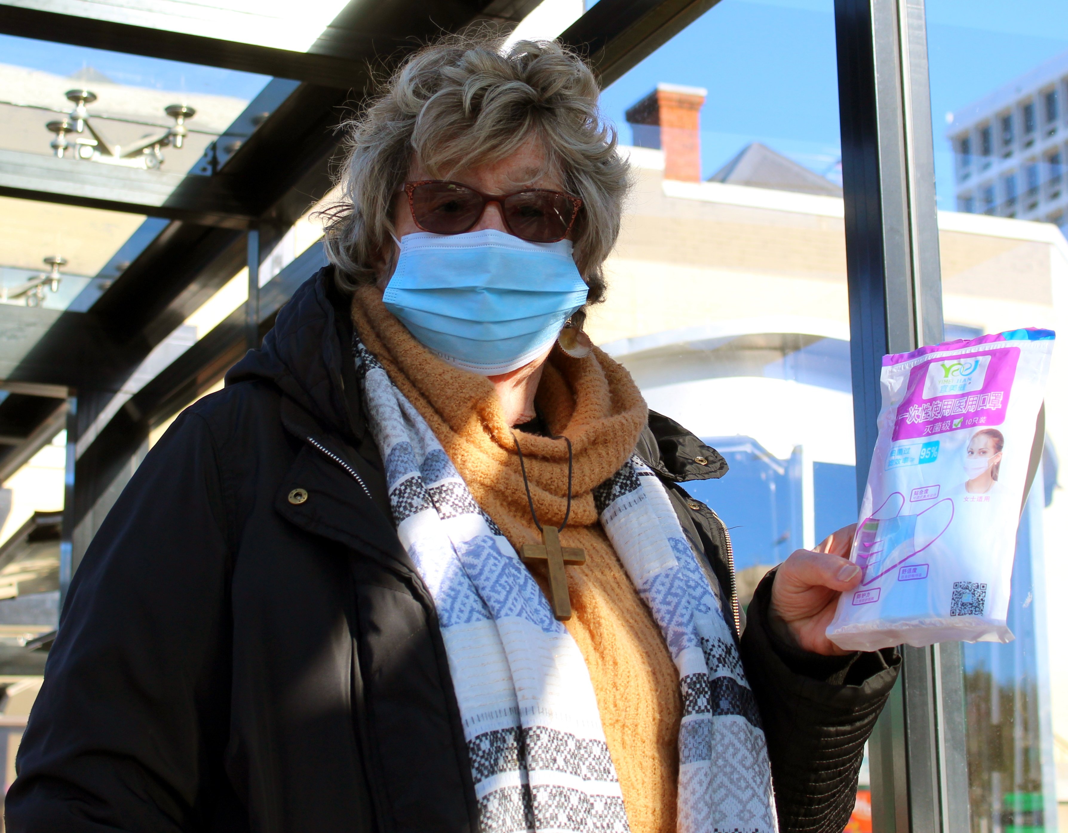 Anne Marie Parsons, of Kaikorai Valley, shows face masks she gives out for free to bus users....