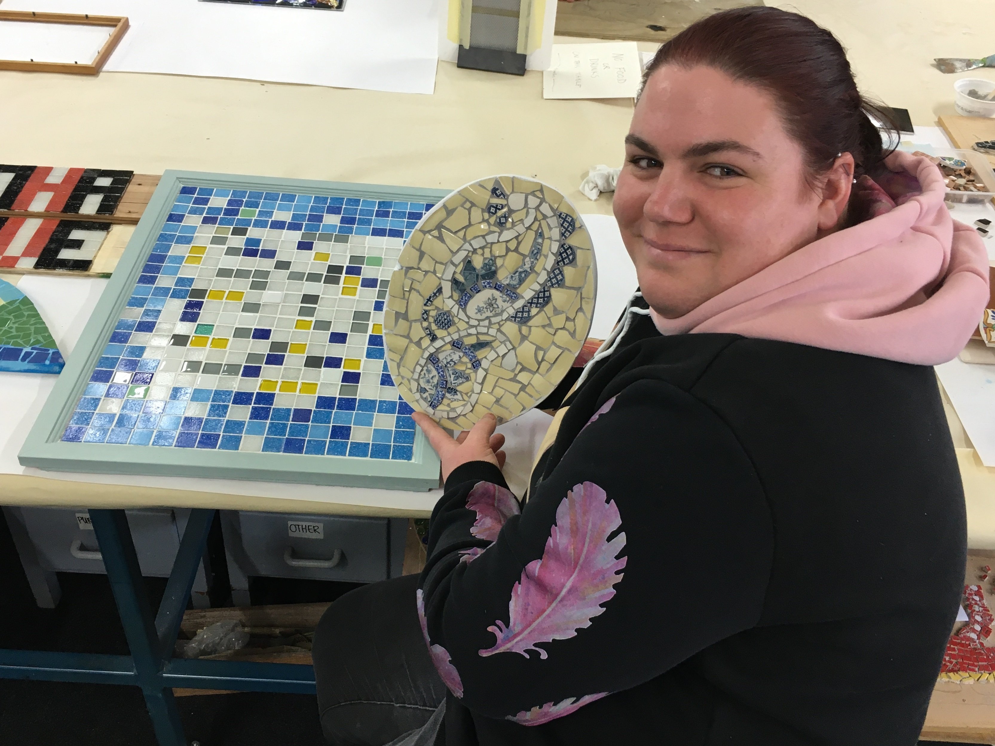 Kelly New, of South Dunedin, shows a mosaic she created from broken teapots and saucers at...