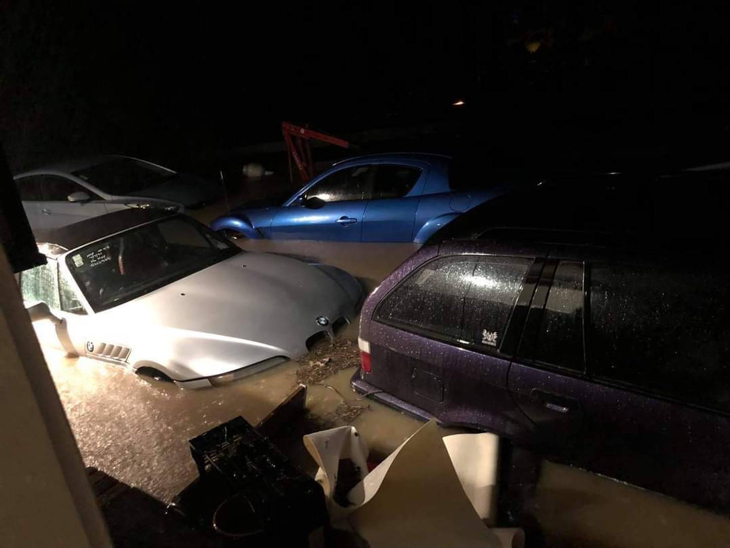 Flooded cars in Kumeu early this morning. Photo: NZ Herald