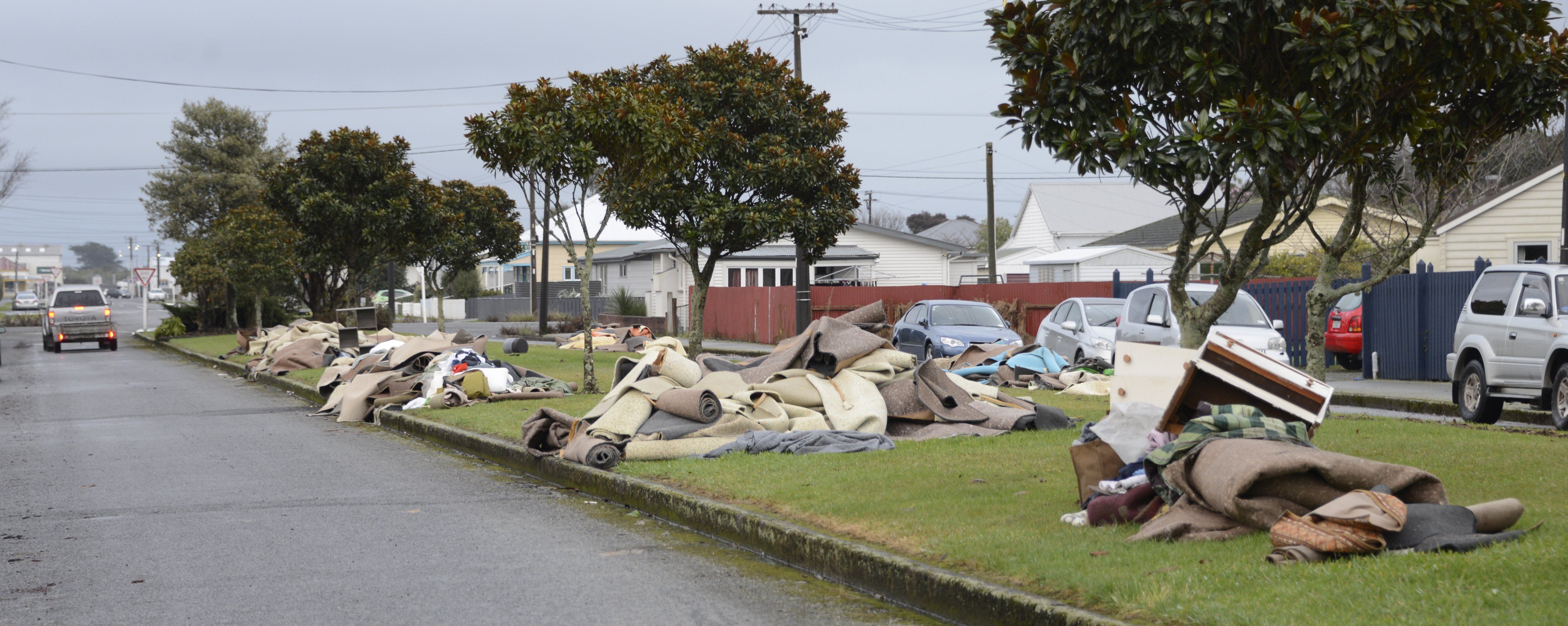 Carpets and flood waste line the streets of Westport after floods devastated the region last week...