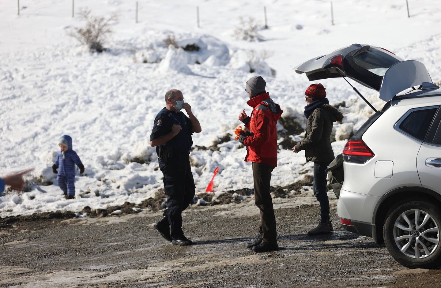 Police speaking to people at the summit of the Crown Range Rd today. Photo: NZ Herald

