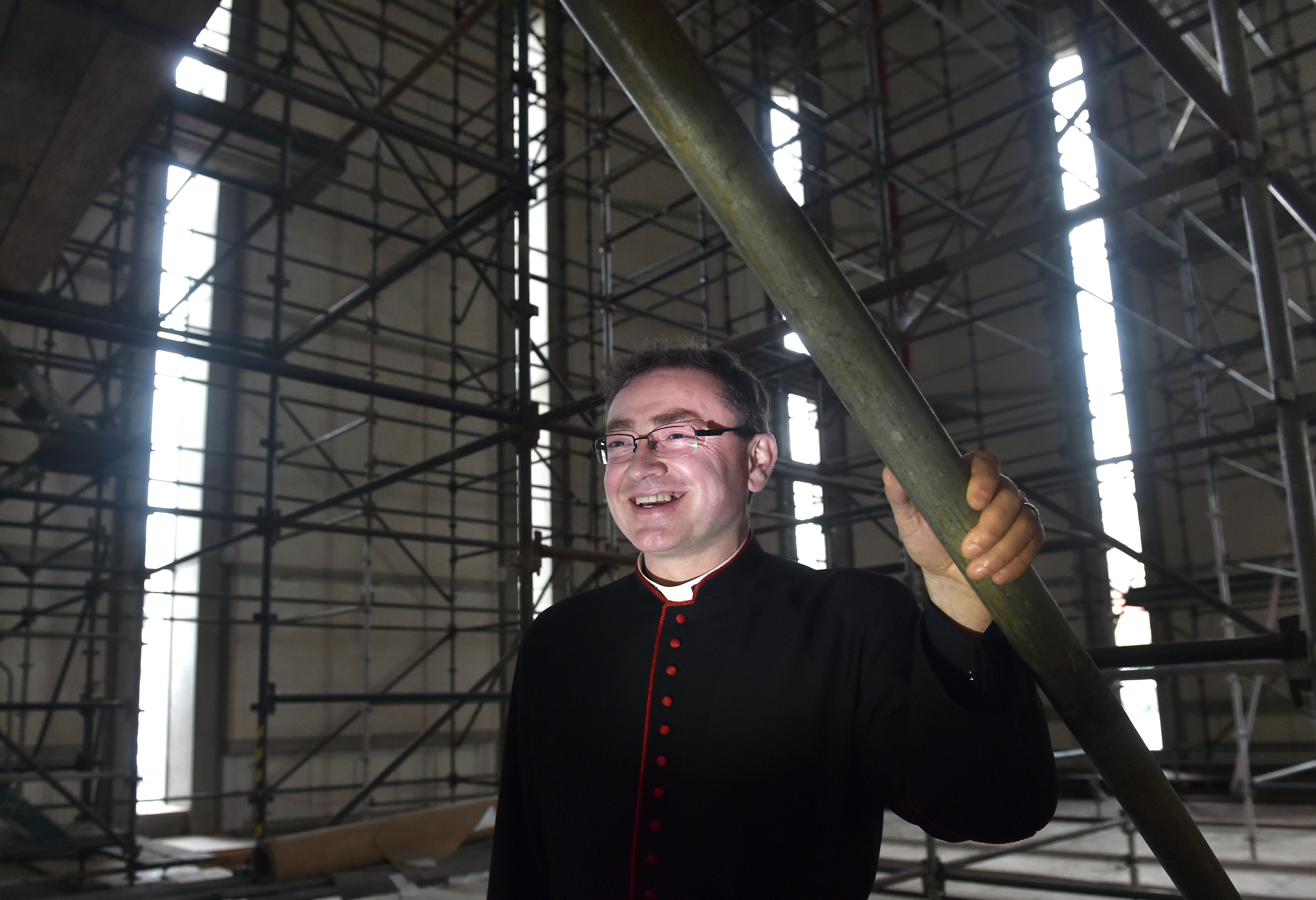 The Dean of St Paul’s Cathedral, the Very Rev Dr Tony Curtis stands among scaffolding in the...