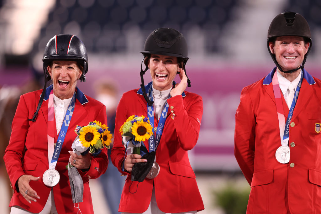 Laura Kraut, Jessica Springsteen and McLain Ward of Team United States pose with their silver medals. Photo: Getty Images