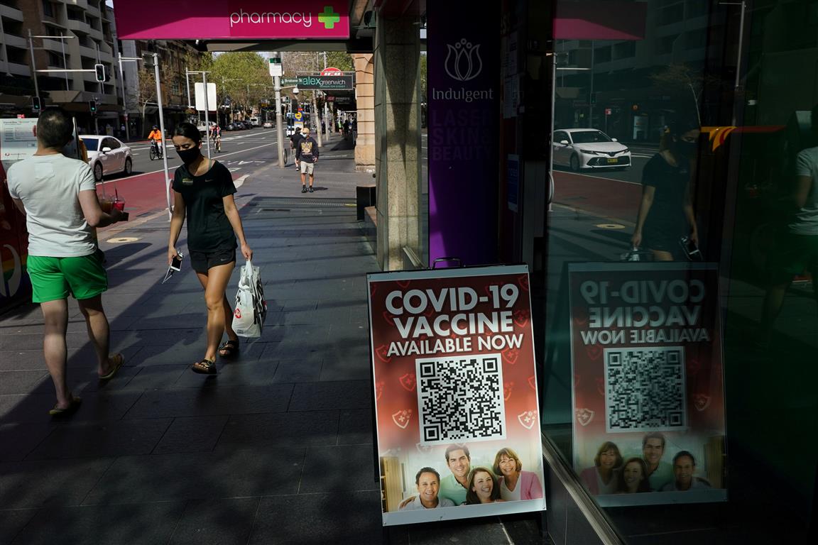 A sign advertises Covid-19 vaccines at a Sydney pharmacy. Photo: Reuters