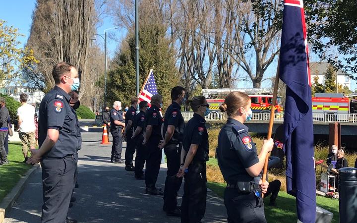 NZ firefighters form a guard of honour at the site of the memorial this morning. Photo: RNZ