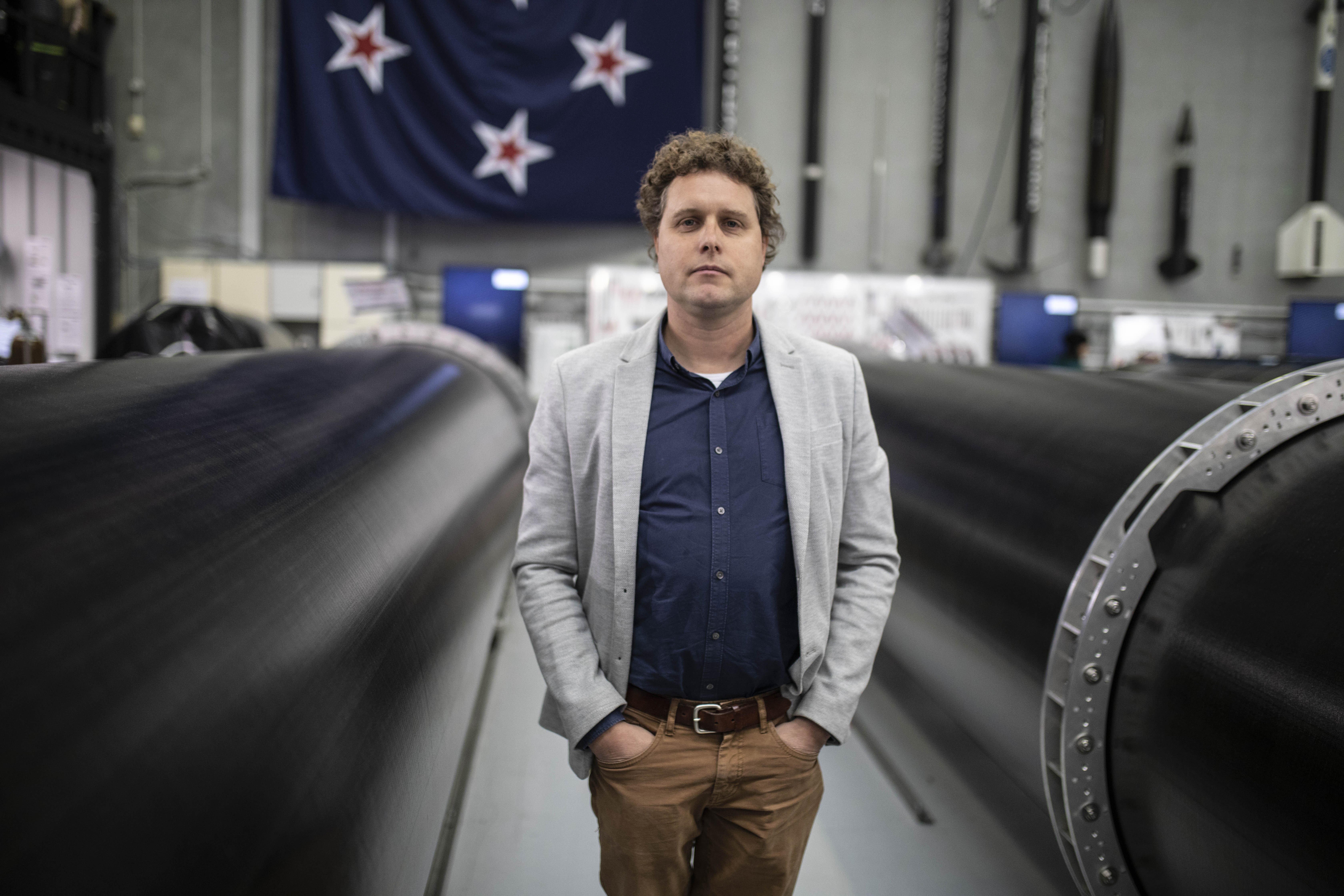 Rocket Lab founder Peter Beck, surrounded by some his rockets in 2018. PHOTO: THE NEW ZEALAND HERALD