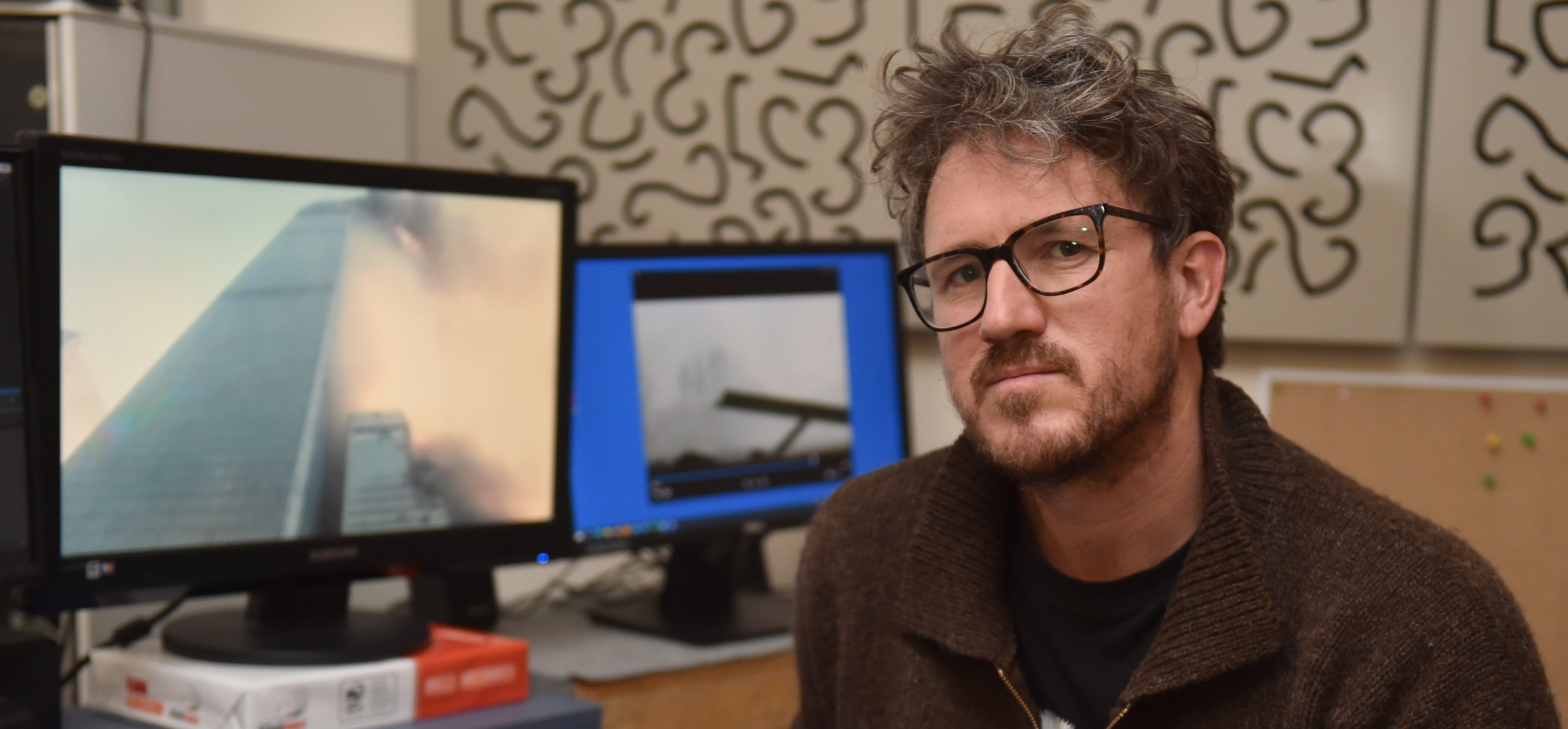 Film-maker Bill Morris with some of the footage he edited into a NHNZ documentary commemorating...