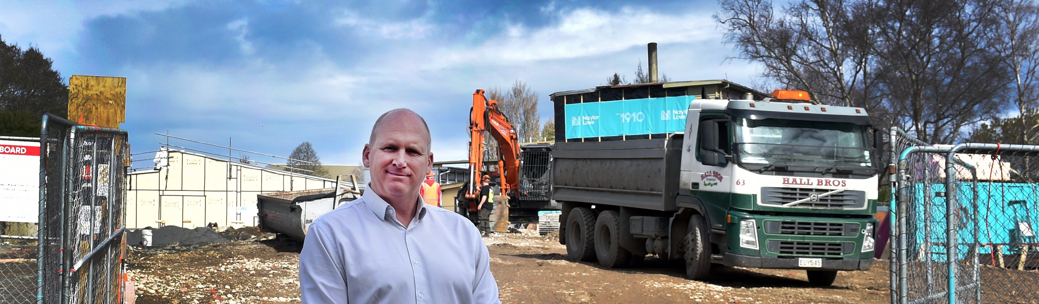 Kaikorai Primary School principal Simon Clarke stands in front of a block of classrooms which...