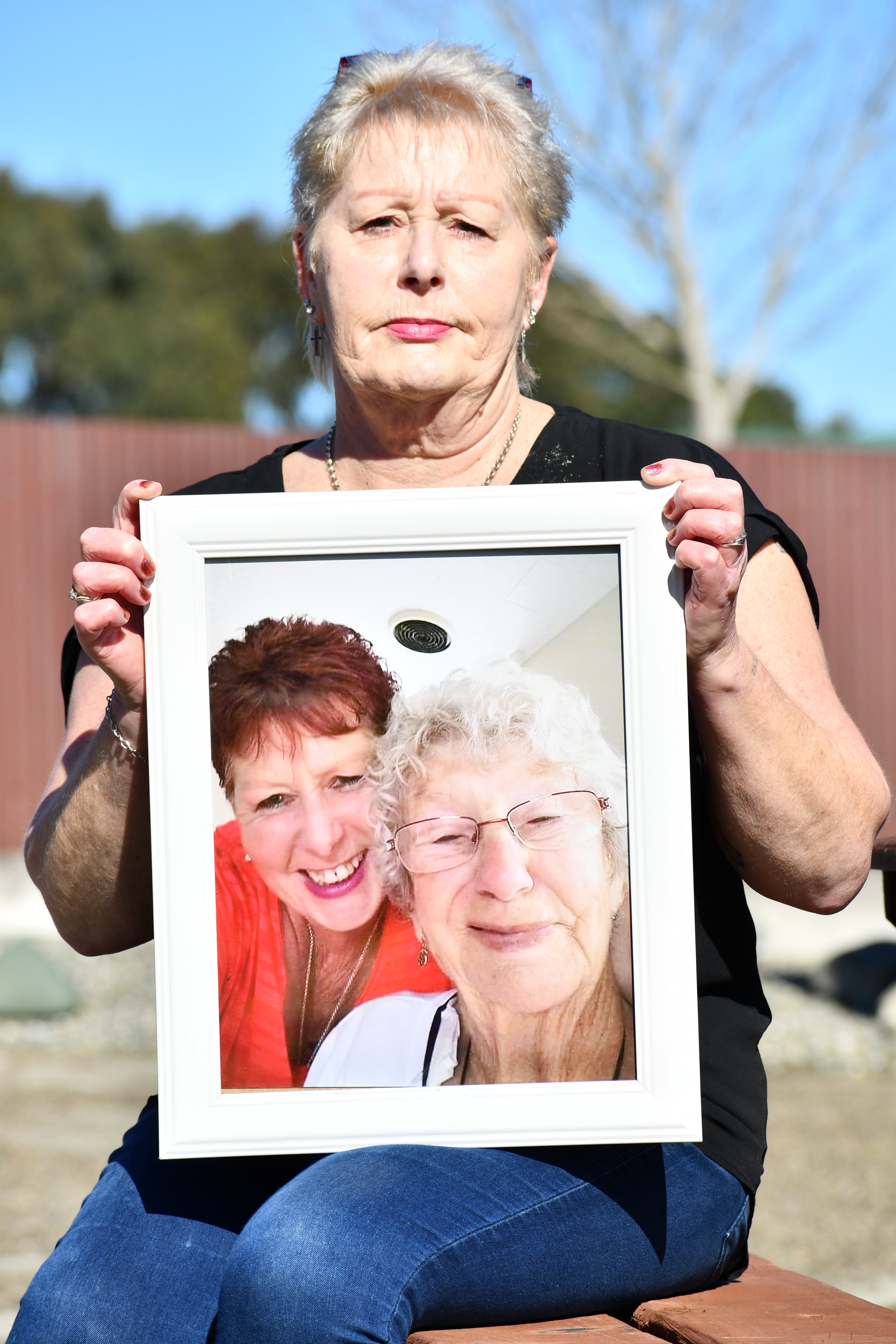 Joanne Watson, holding the last photo taken of her and her mother Nancye MacKenzie, says the...