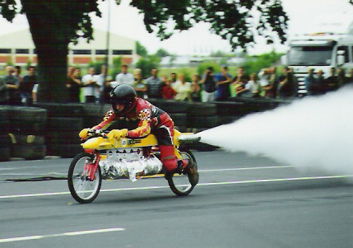 Mr Beck demonstrates his steam-powered bike in Dunedin’s Princes St, at the Festival of Speed,...