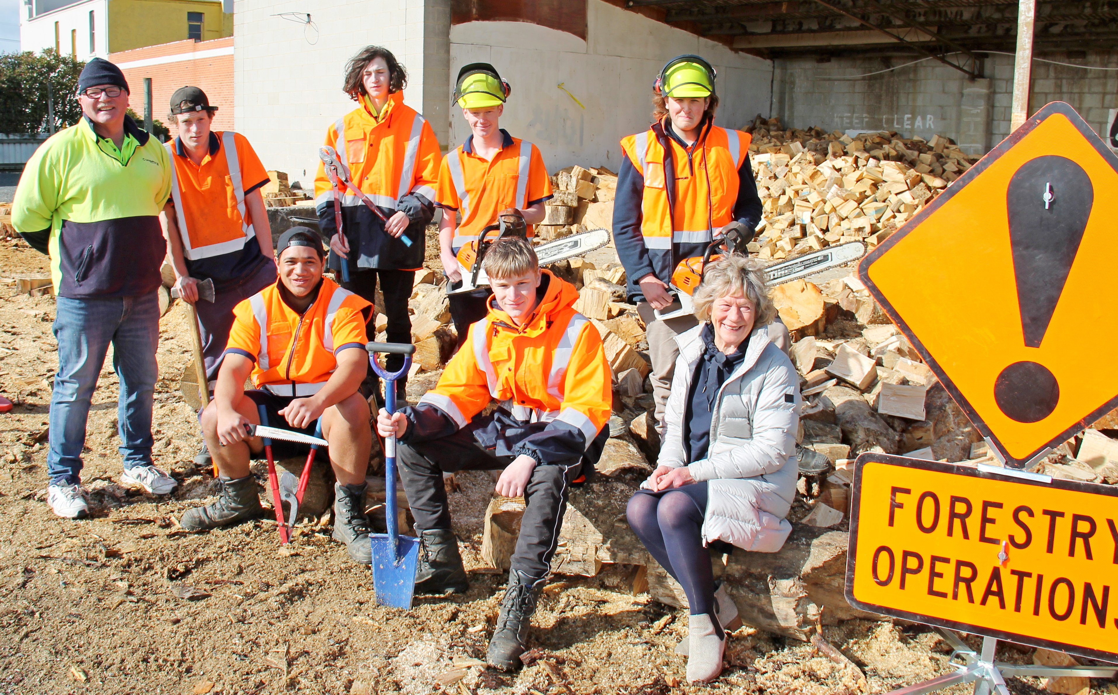 Hoping the Governmentwill continue to support them are Tokomairiro Training Forestry Pathways personnel (from left) tutor Alistair McKenzie, Connor Brown, Taine Parker (seated), Luke Hewison, Harvey Pringle, Michael Bennett (seated), Anthony Smart and pro