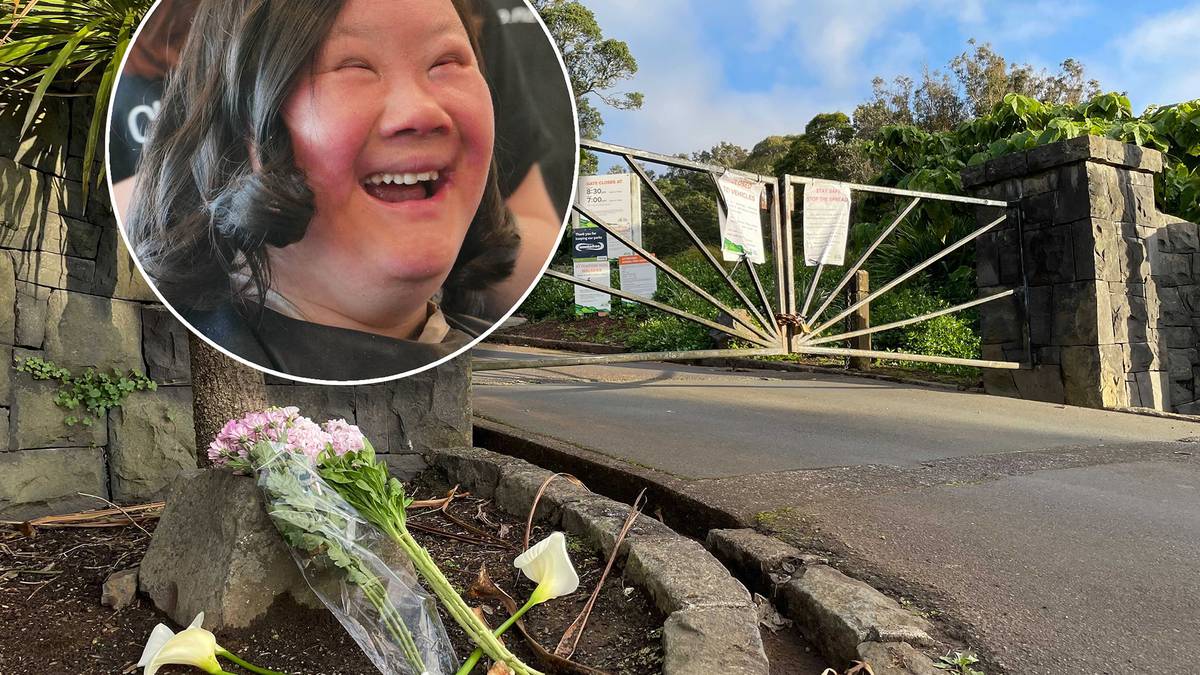 Flowers lie at the top of the bush-lined walkway where Lena Zhang Harrap's body was found on...