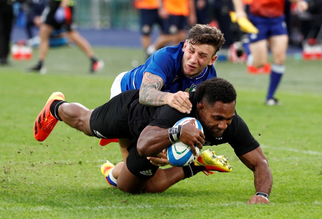 Sevu Reece dives over to score for the All Blacks against Italy. Photo: Reuters