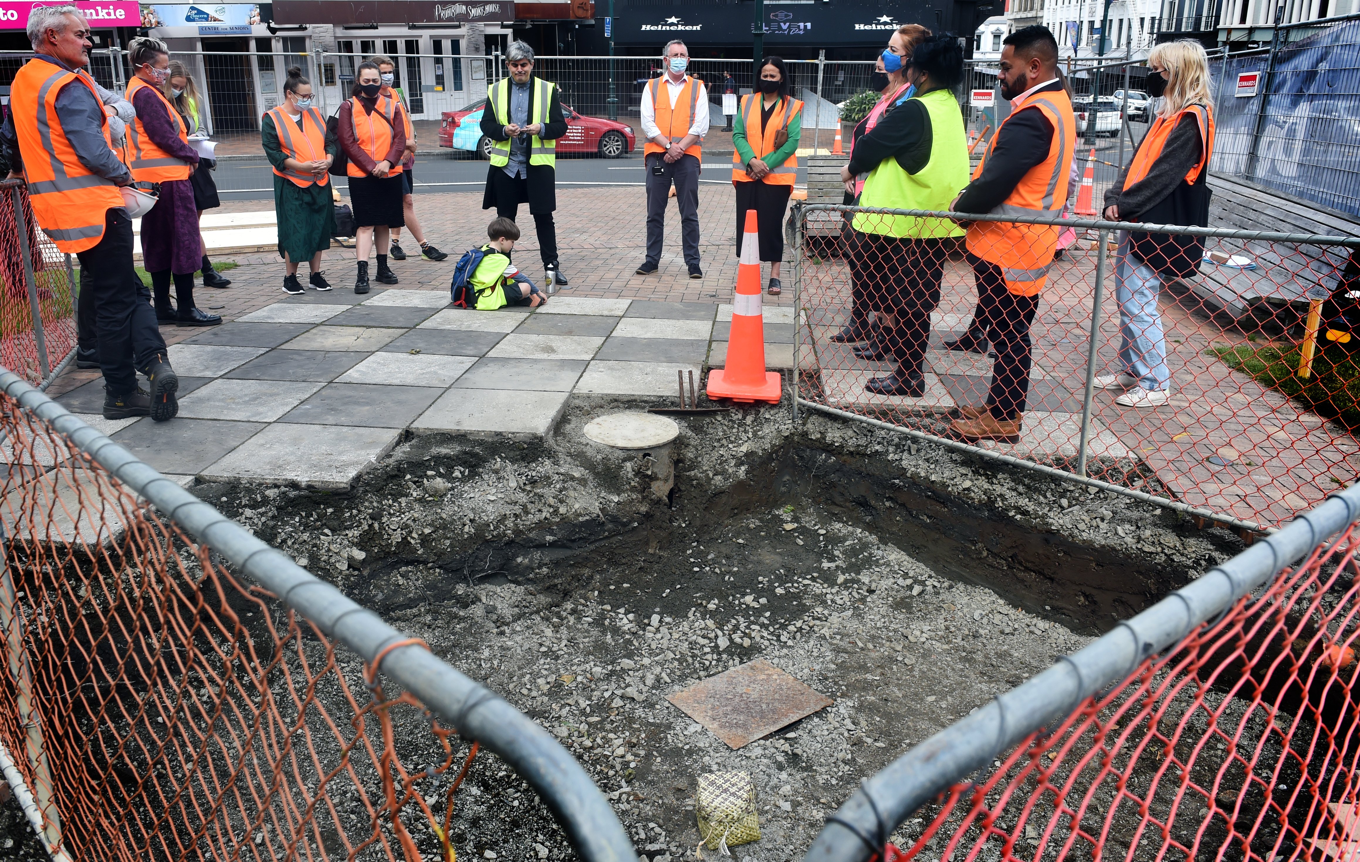 Members of the Dunedin City Council and local runaka share a karakia in the Octagon yesterday, as...