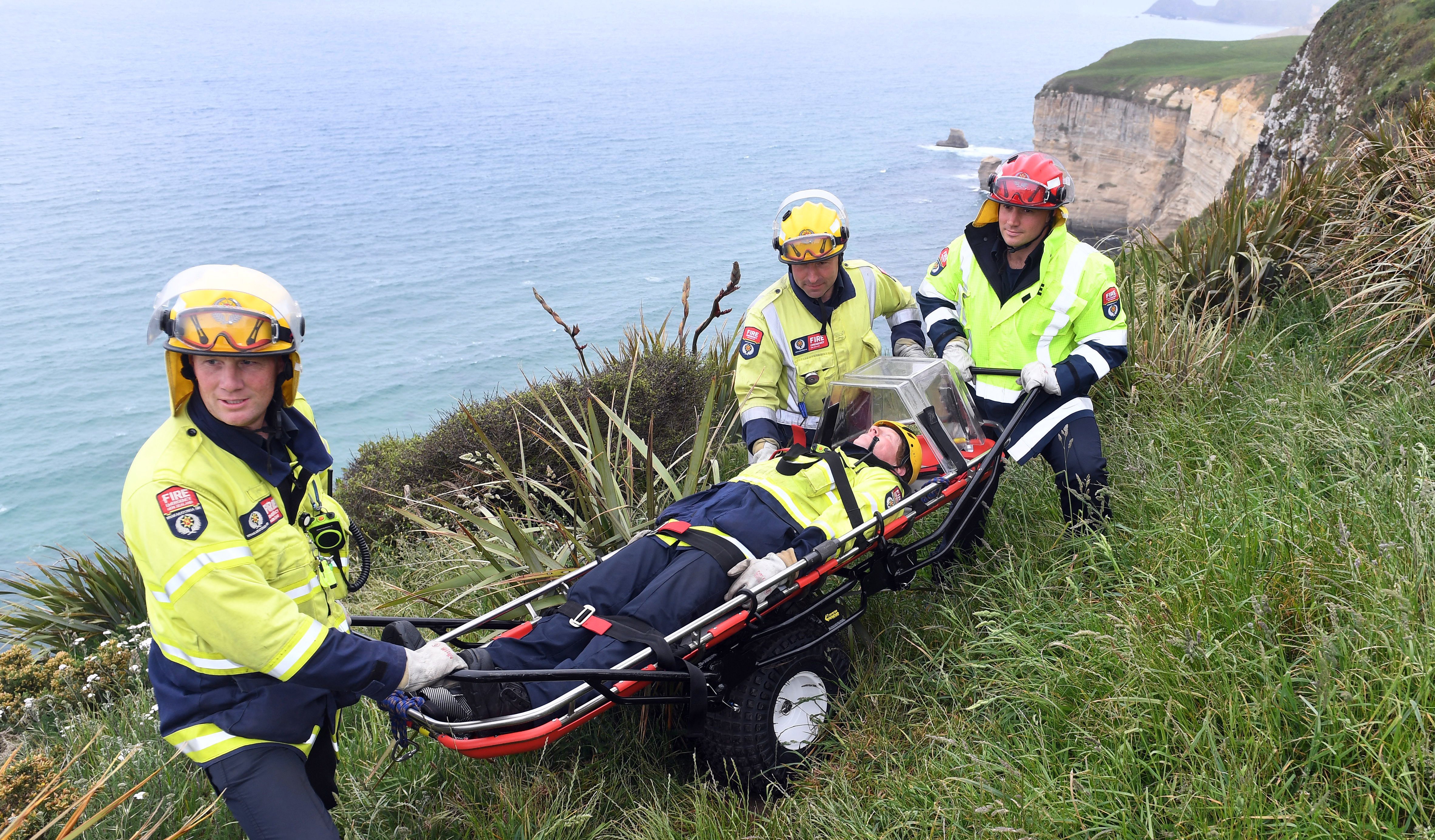 Senior firefighters Tony McEntyre (front), Mike Taylor (centre back) and Lookout Point station...