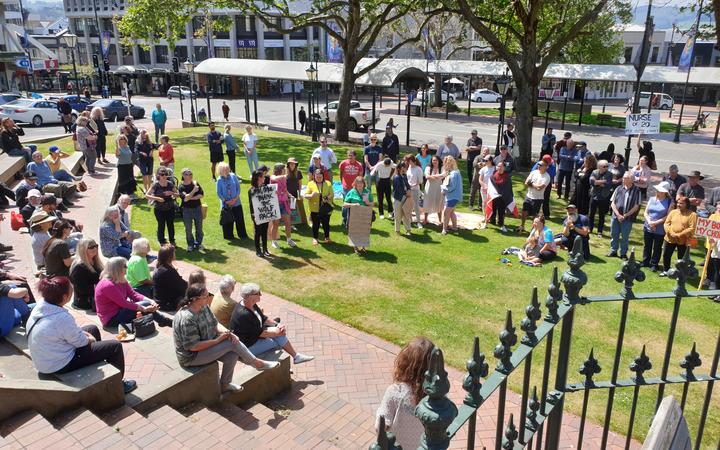 Lauren Brangrove's poster is visible in the distance of an anti-lockdown protest in Dunedin's...