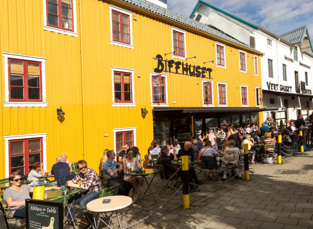 People outdoors at a pub in Tromso, Norway. Photo: Getty Images