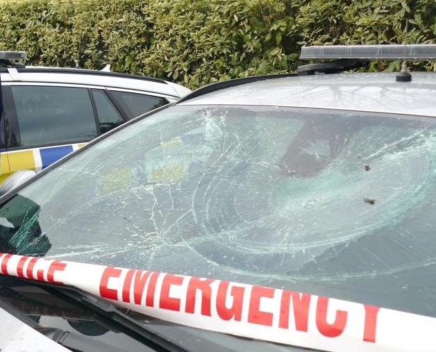 Windscreens of two private vehicles and six police vehicles were damaged in the attack. Photo:...