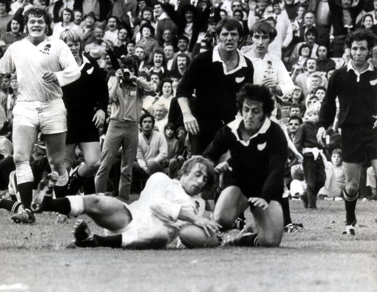 Terry Morrison (second from left), watches as England score a try in their win over the All...