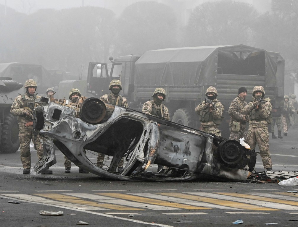 Troops in the main square in Almaty, where hundreds of people were protesting against the...