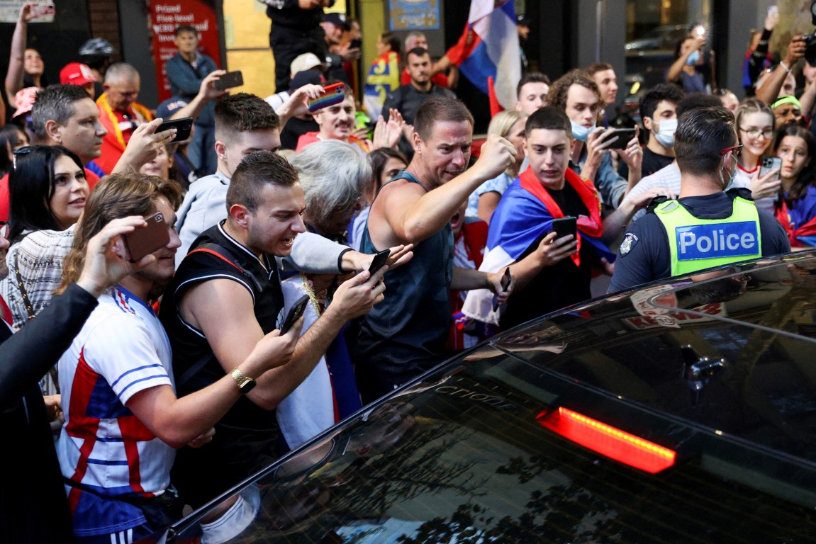 Supporters of Novak Djokovic confront police in central Melbourne. Photo: Reuters