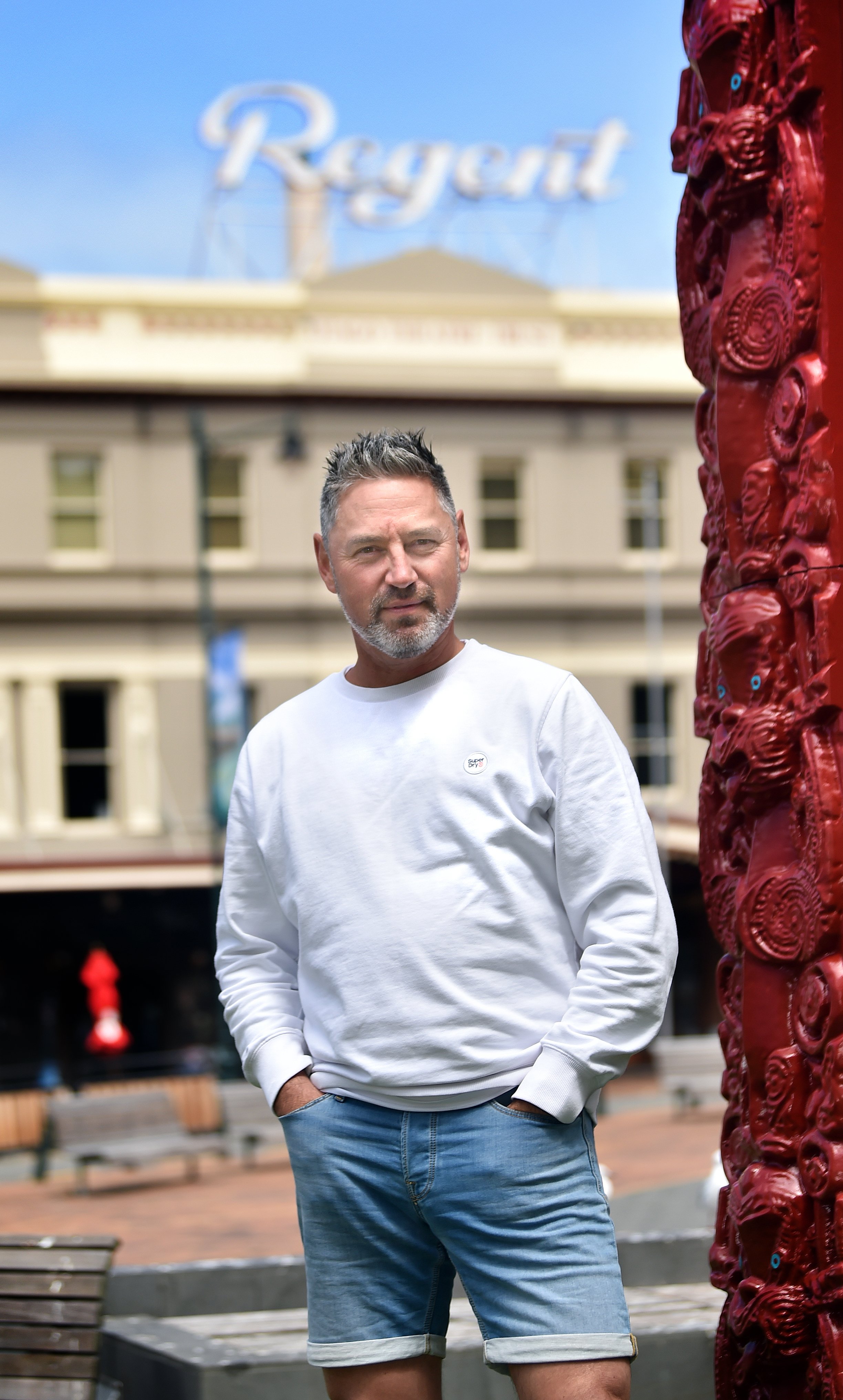 Dunedin entertainer and producer Doug Kamo stands outside the Regent Theatre in the Octagon...
