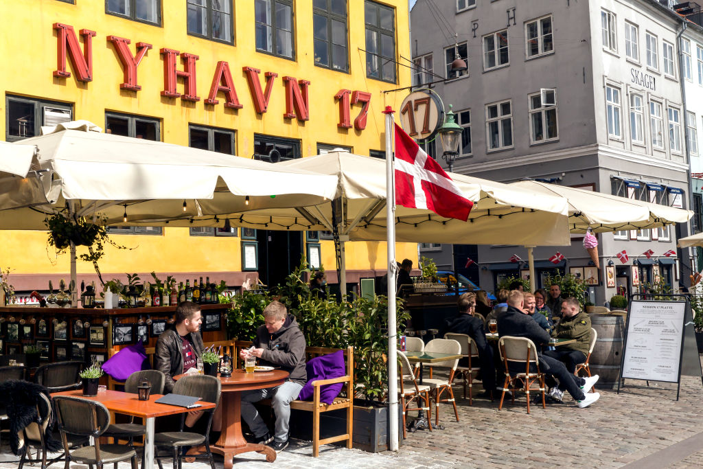 Diners at a restaurant in the Nyhavn district of Copenhagen. Photo: Getty Images