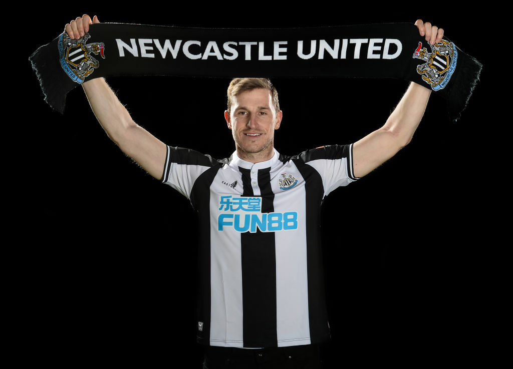 Chris Wood poses with a Newcastle Scarf at the Newcastle United Training Centre. Photo: Getty Images