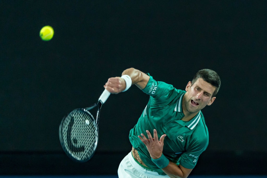 Novak Djokovic serves during his quarterfinal win at the Australian Open last night. Photo: Getty...