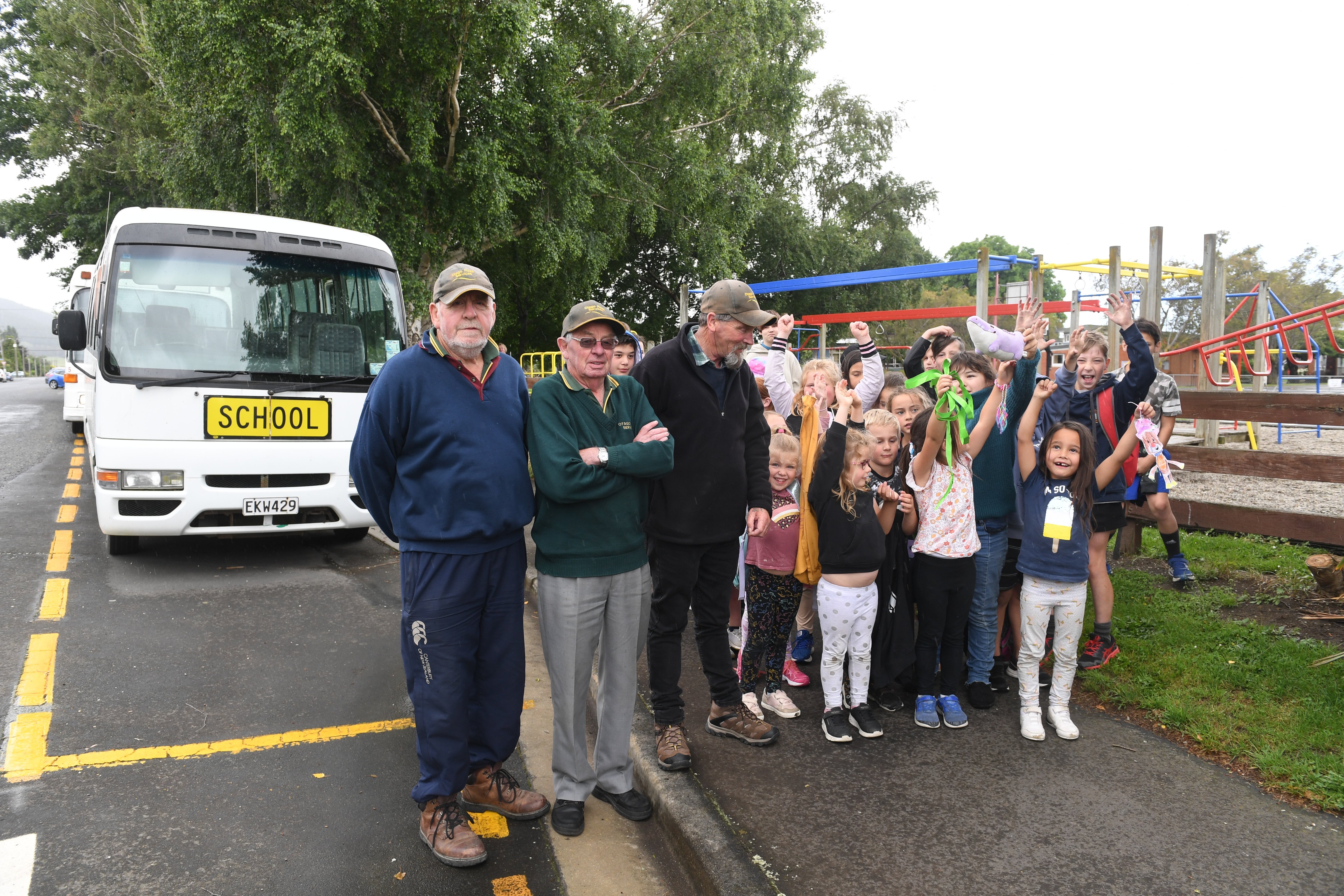 Pupils from the Outram school bus run wish their drivers farewell at the end of the 2021 school...