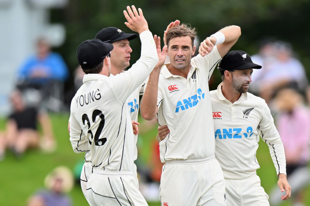 New Zealand's Tim Southee (c) is congratulated by teammates after dismissing South Africa's Kyle...