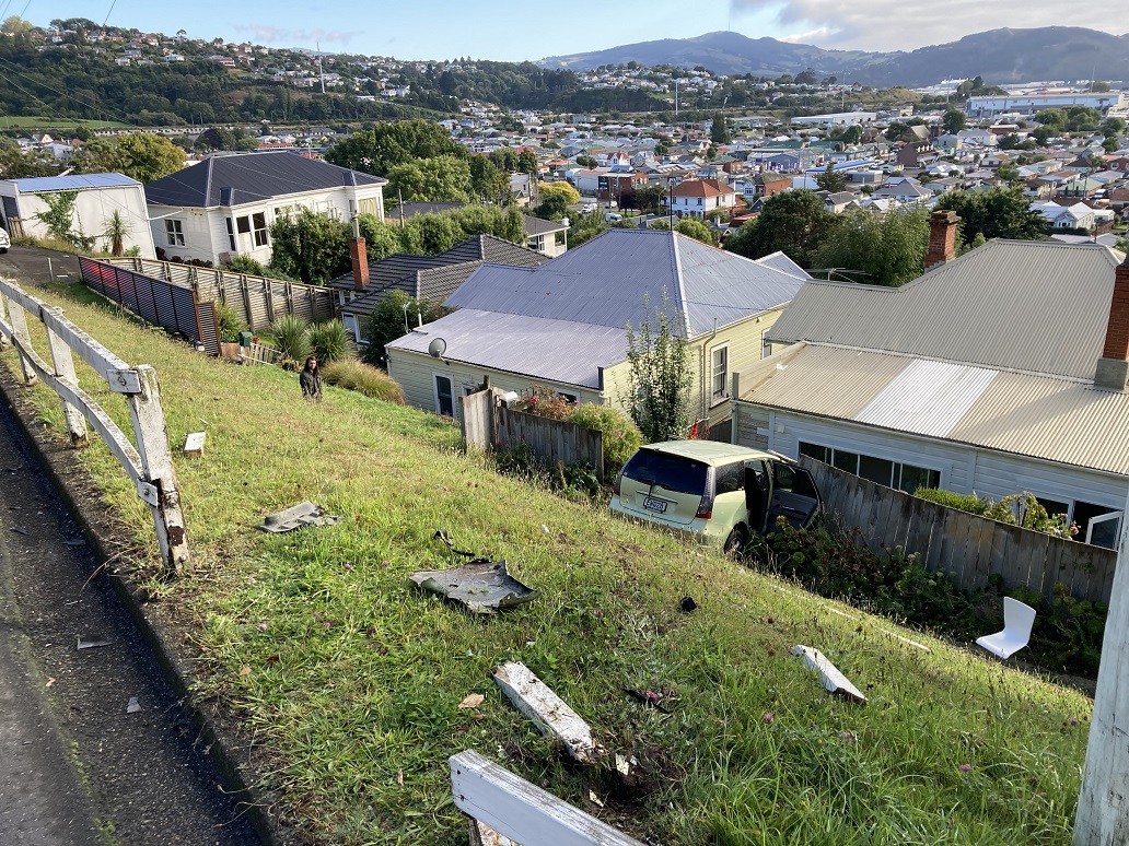 One car went through a fence and down a steep bank in Easther Crescent this morning. Photo:...