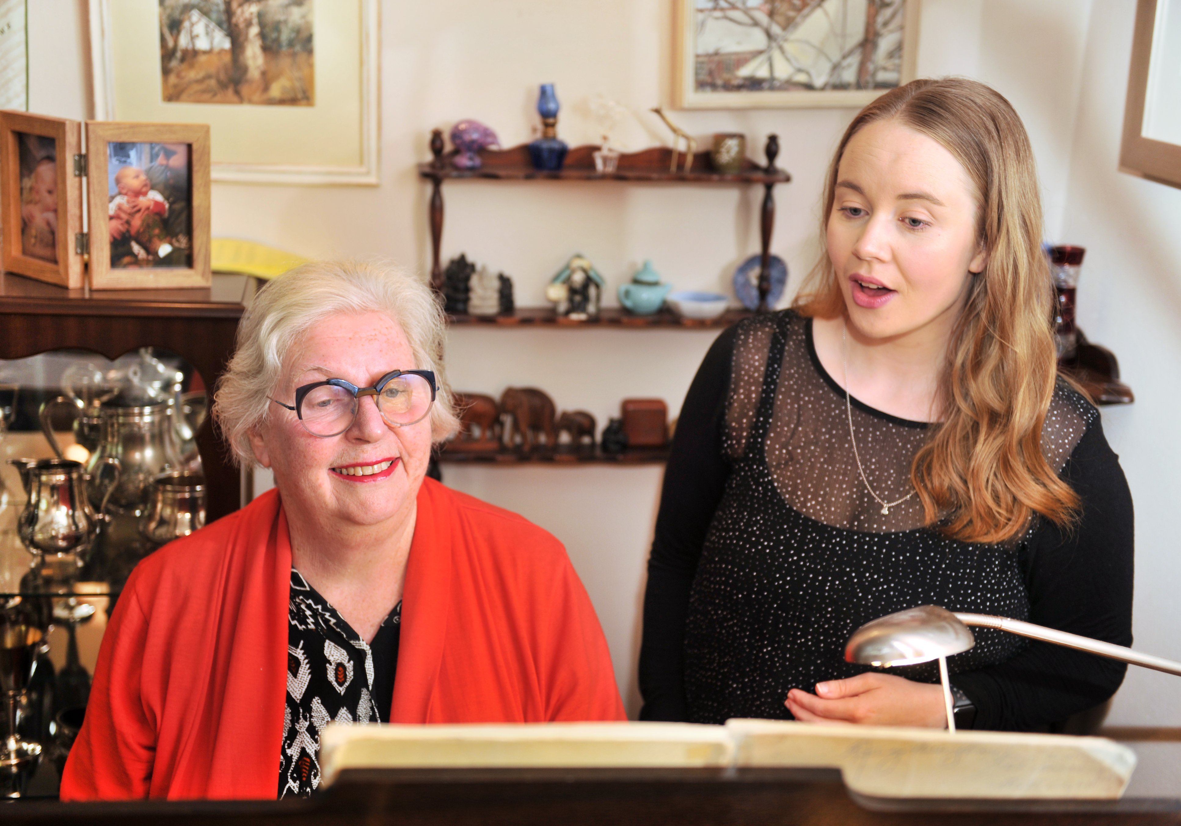 Singing teacher Judy Bellingham works with student Cathy Highton in preparation for the upcoming...