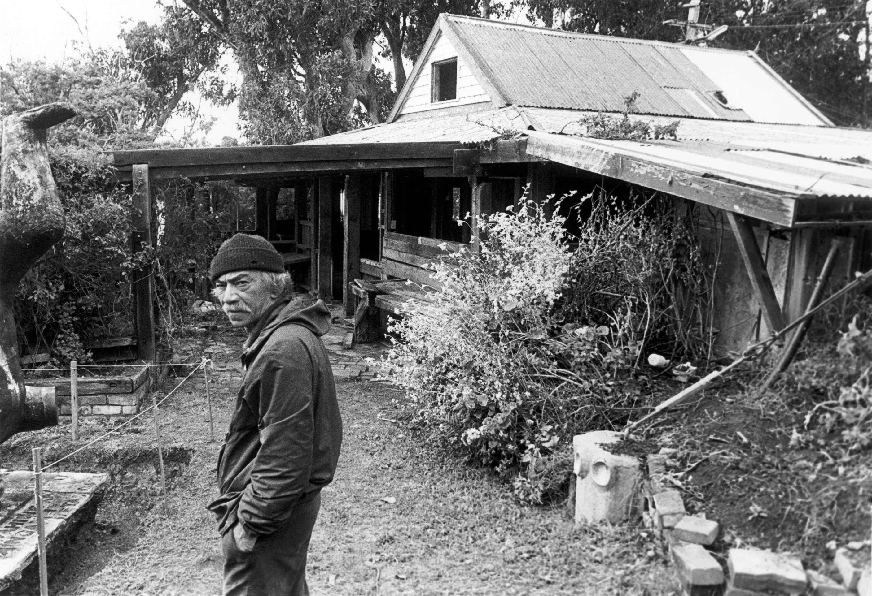 Artist the late Ralph Hotere stands outside his Observation Point studio, now a category one...