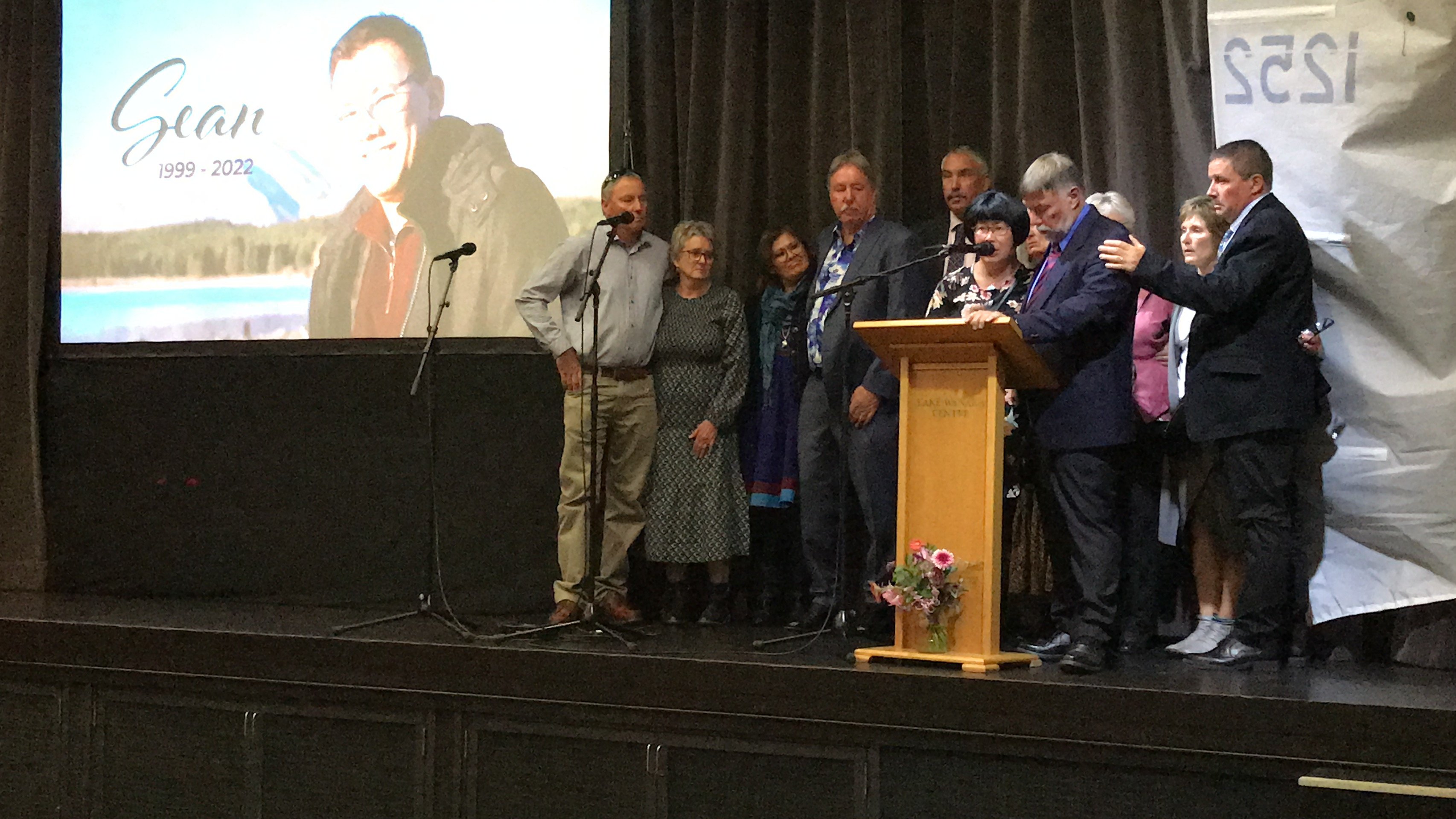 Sean Dickey’s parents Steve (second from right) and Mai Lian Dickey (centre) speak at their son’s...