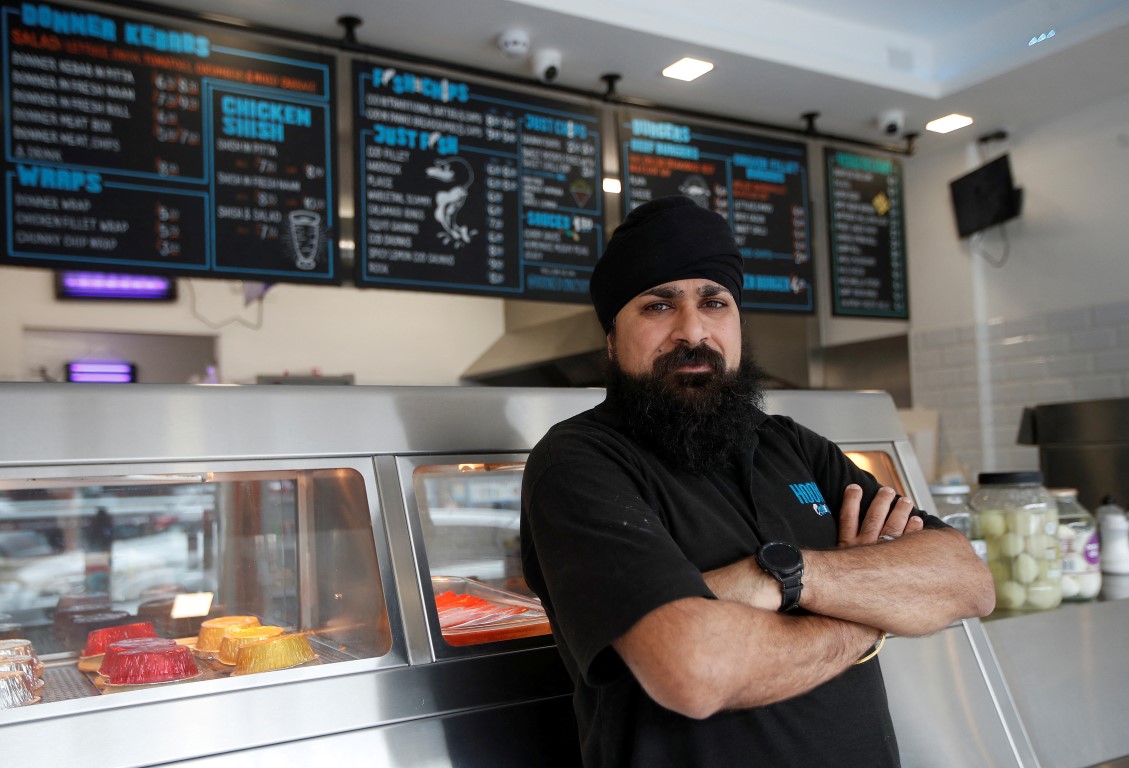 Bally Singh at his Hooked Fish and Chips shop in West London. Photo: Reuters