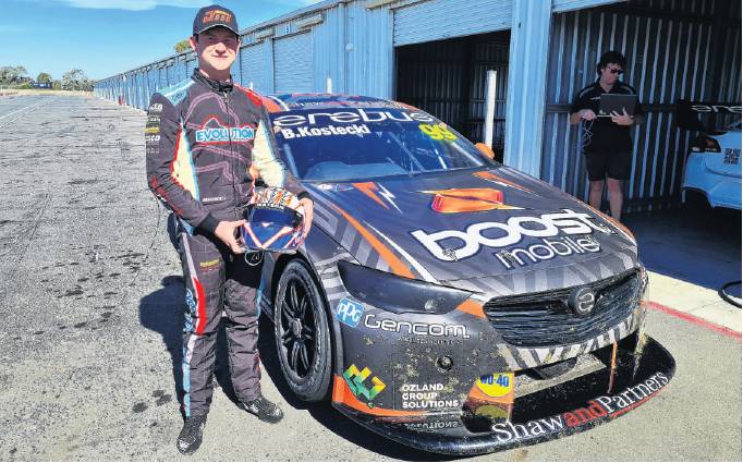 Jordan Michels with the Holden Commodore Supercar he tested in Australia recently. PHOTO: SUPPLIED