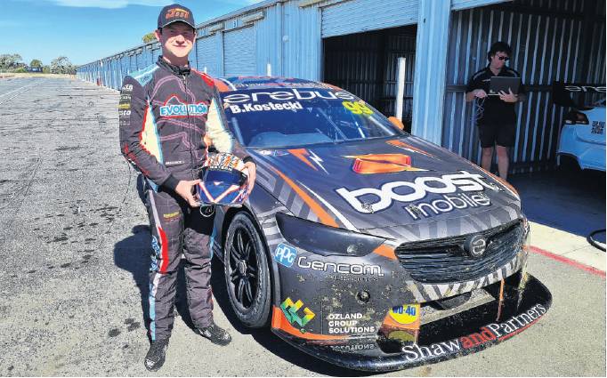 Jordan Michels with the Holden Commodore Supercar he tested in Australia recently. PHOTO: SUPPLIED
