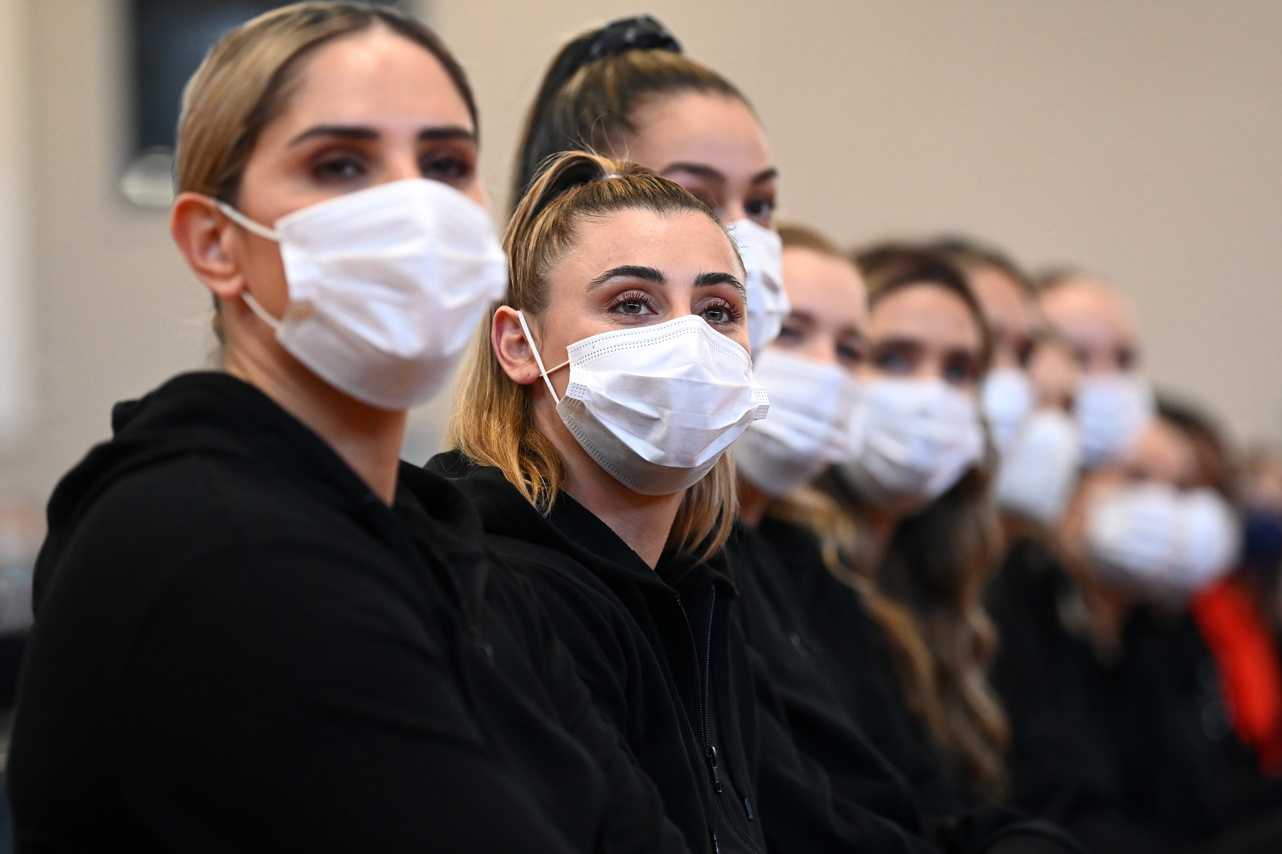 Captain Gina Crampton (second from left) and her Silver Ferns line up for official photographs in...