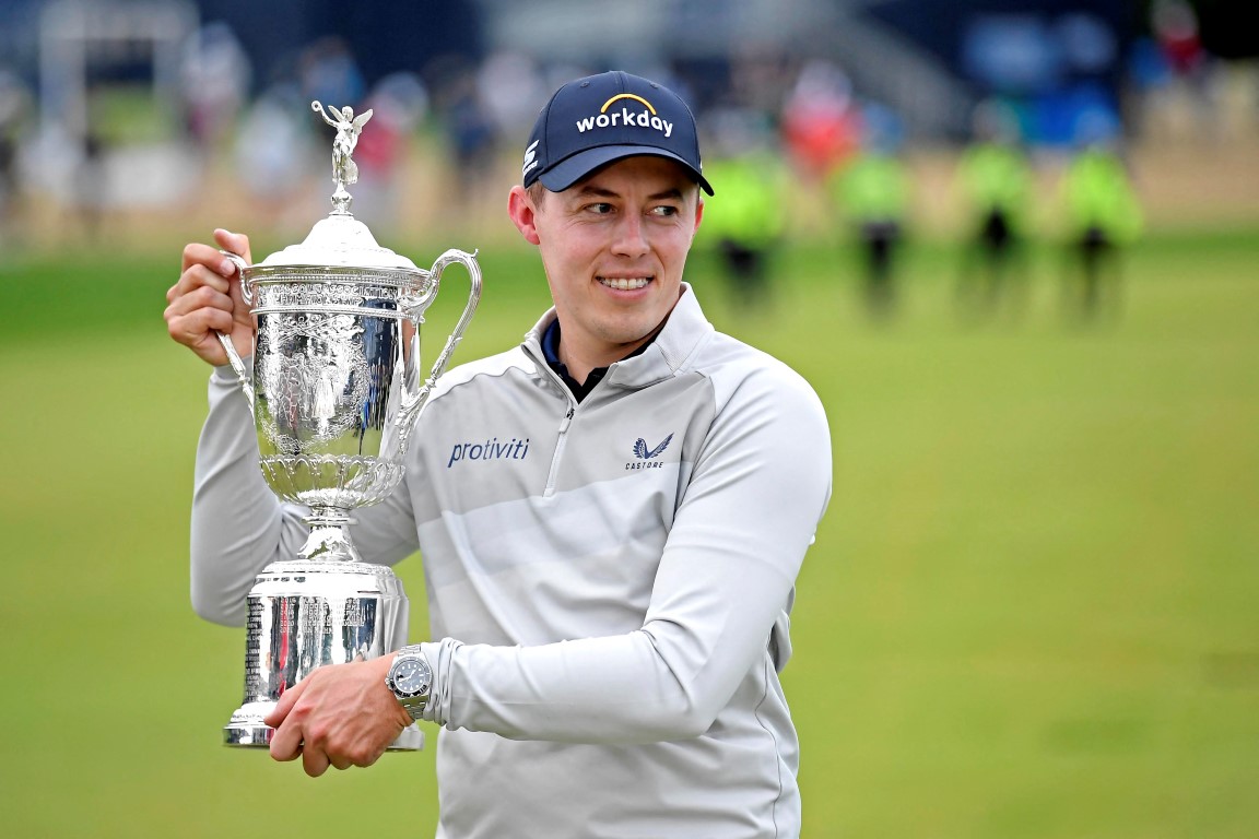 Matthew Fitzpatrick poses with the trophy after his victory in the US Open in Brookline,...