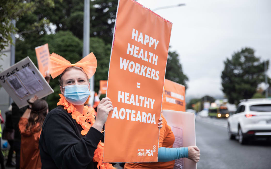 Health workers striking outside Hutt Hospital last month. Photo: RNZ 