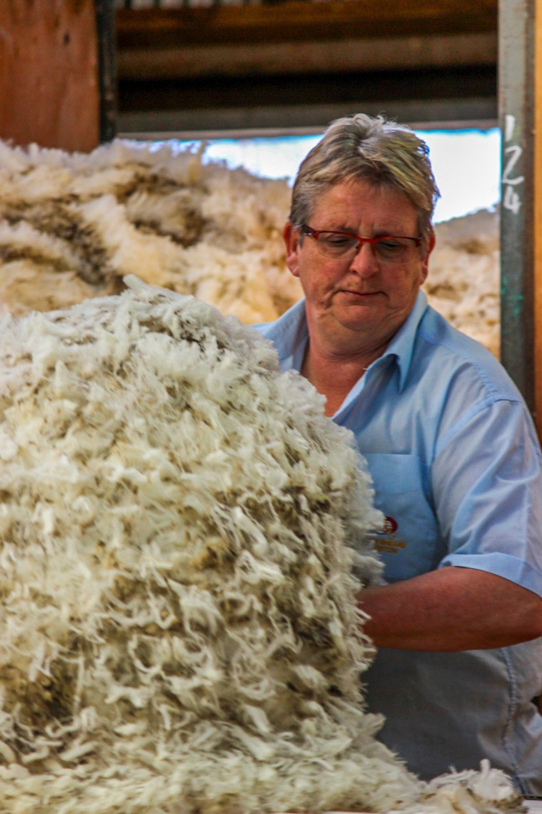 Retiring wool-classer Barbara Newton at work in a shed. PHOTO: SUPPLIED