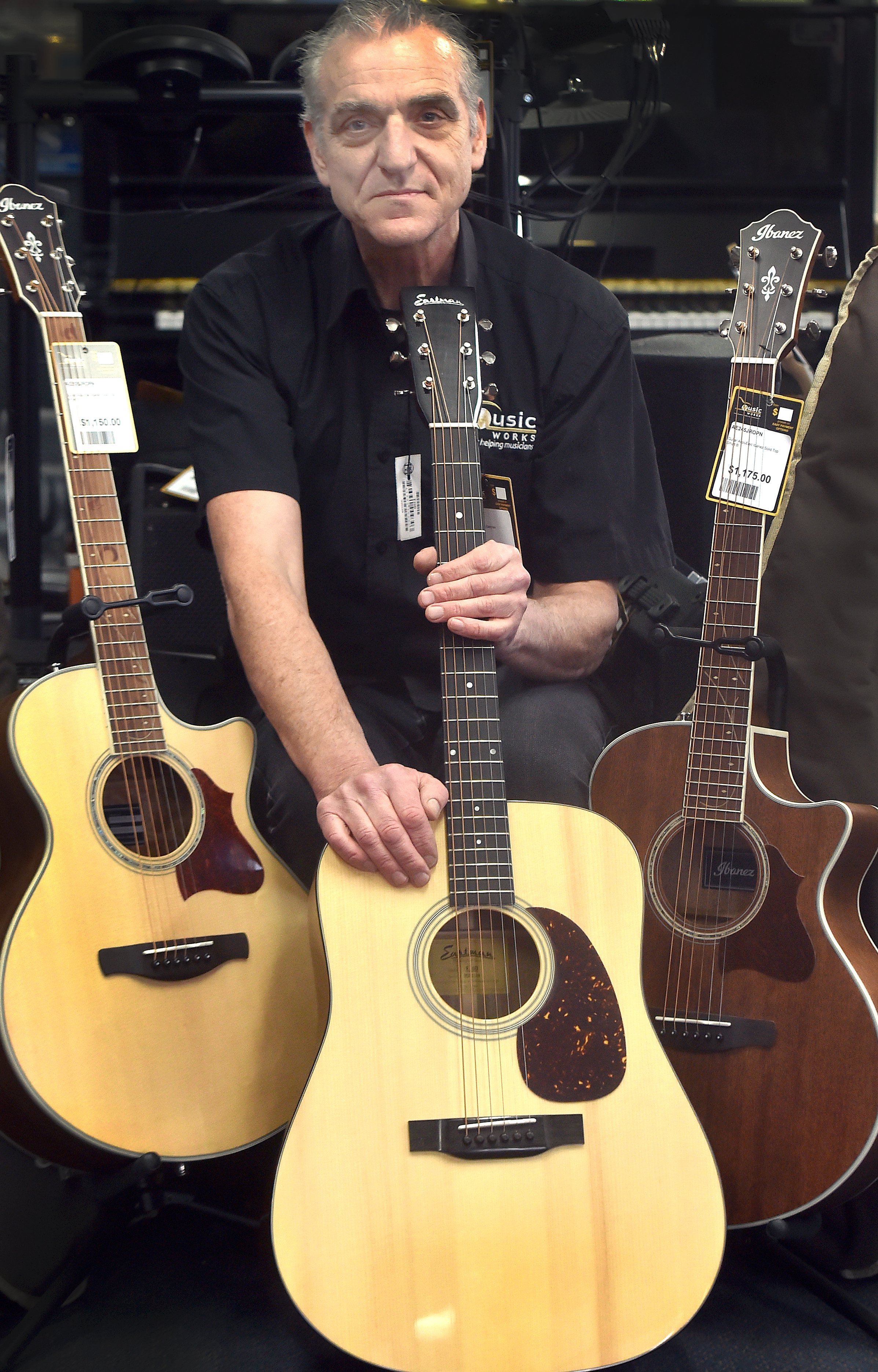 Stevie Rice, manager of Beggs MusicWorks, with a similar guitar to the one which was stolen from...