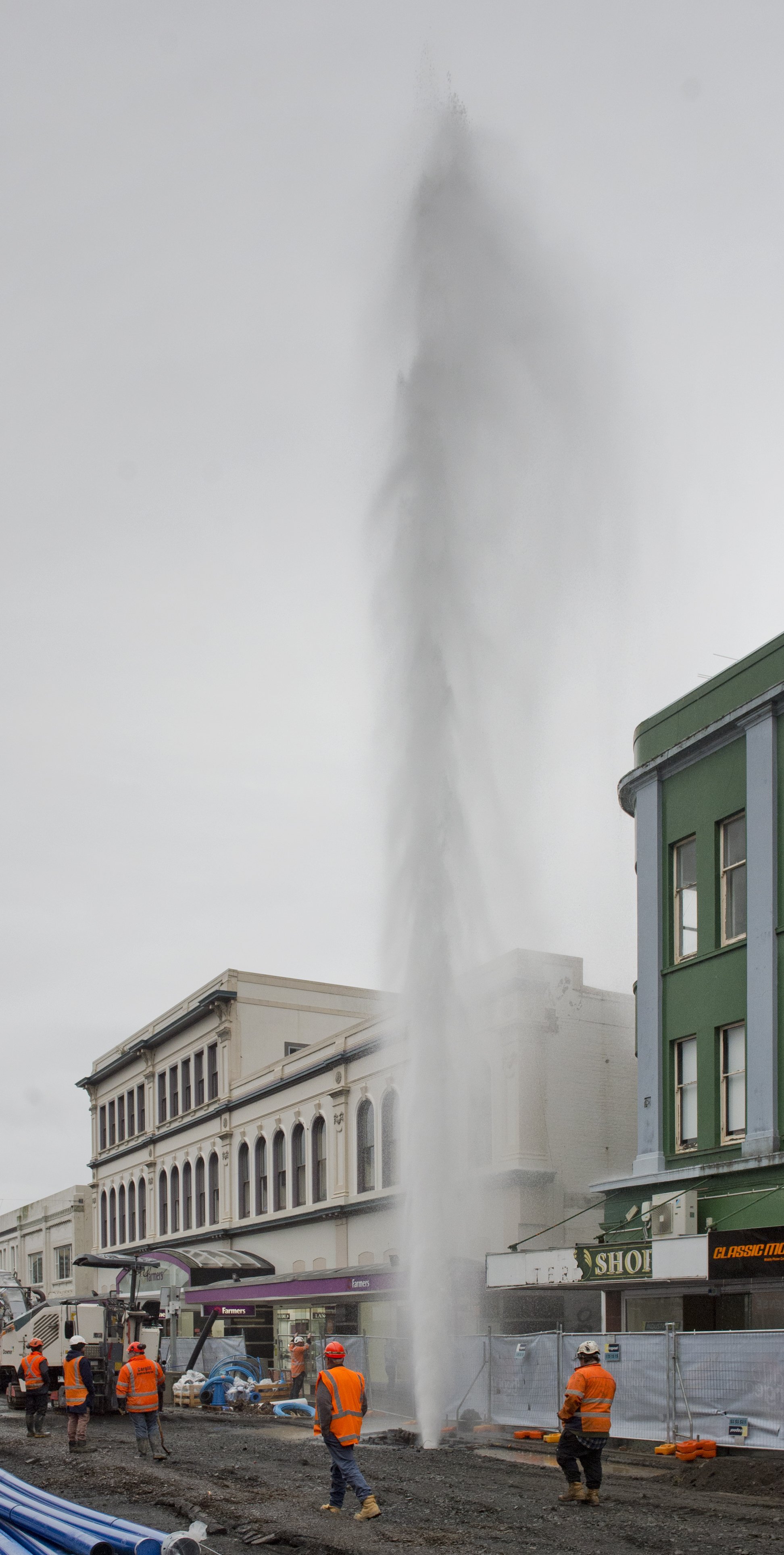 A high-pressure stream of water reaches towards the heavens in George St after a fire hydrant was...