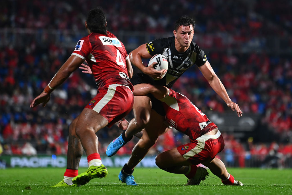 New Zealand's Joseph Manu tries to bust through the Tongan defence. Photo: Getty Images