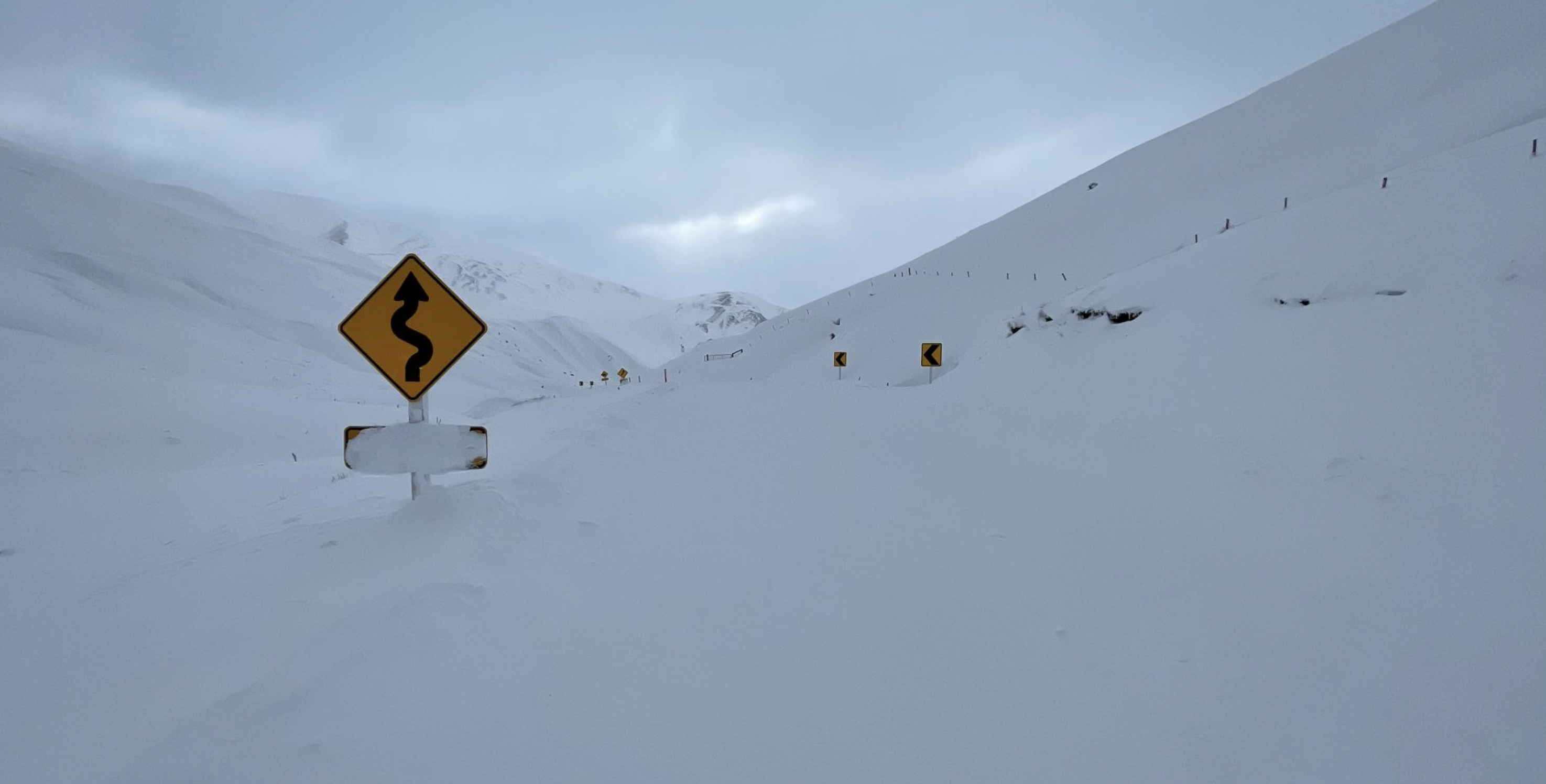 A large dump of snow on the summit of the Crown Range Road. Photo: Downer/ QLDC