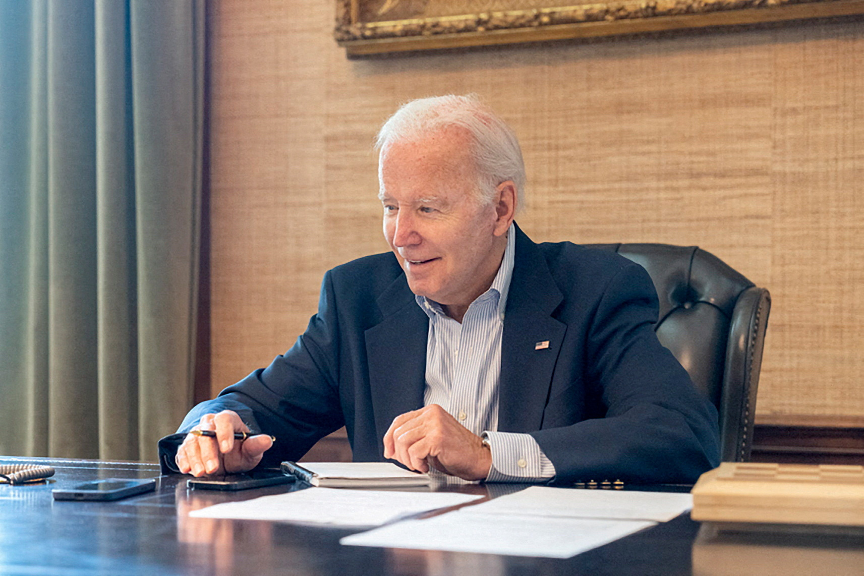 US President Joe Biden sits at his desk in the White House. Photo: Courtesy Twitter President...