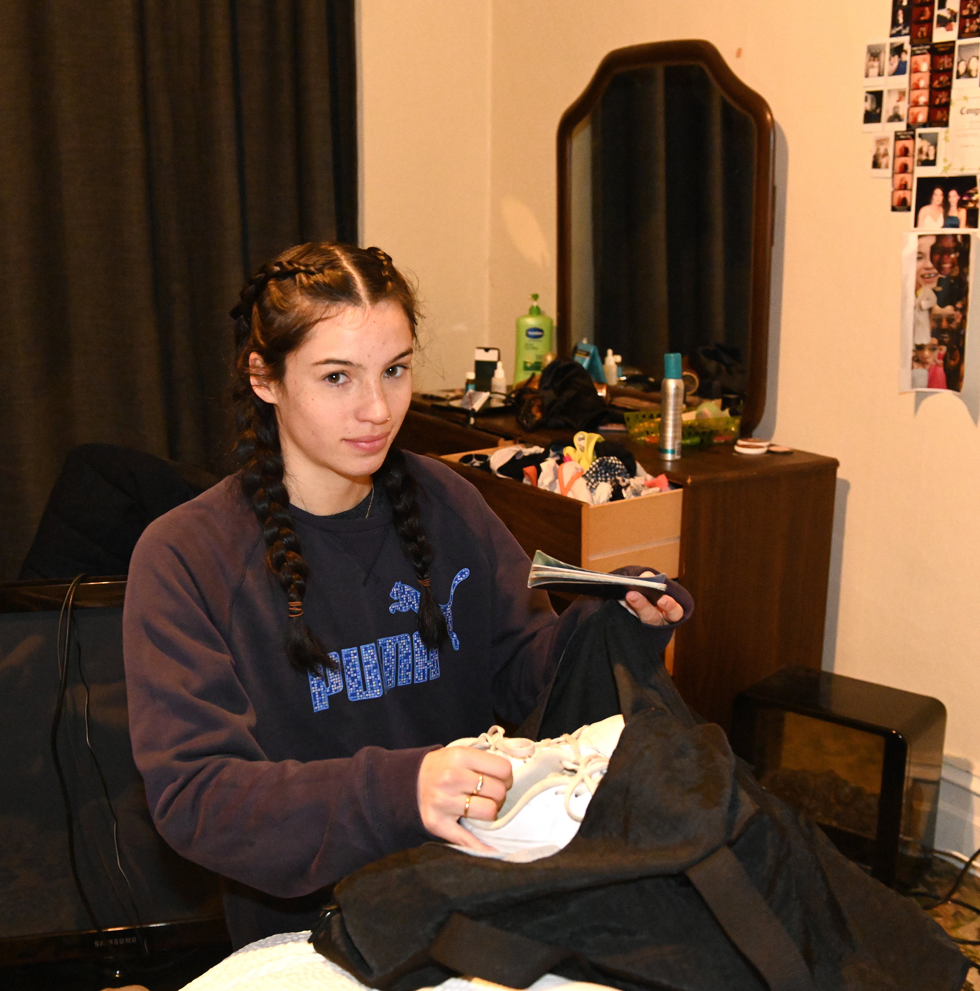 Aimee Clark packs a bag as she prepare to evacuate her Leith St Central flat last night. PHOTO:...