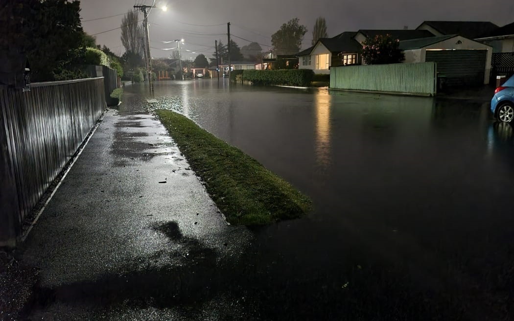Streets in the suburb of Hoon Hay were under water last night. Photo: Tessa Guest