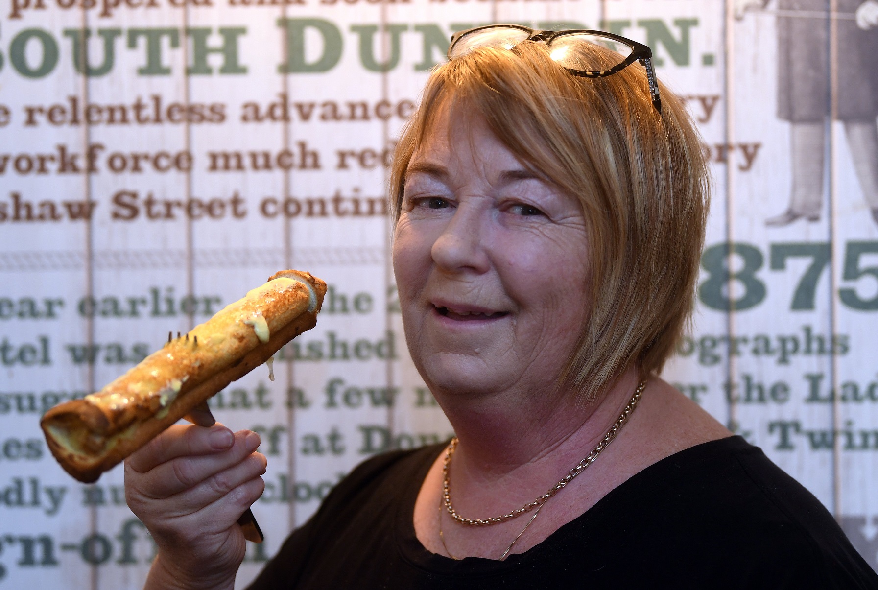 Showing off one of her artisan cheese rolls is Rope and Twine co-owner Joy Jones yesterday. PHOTO...
